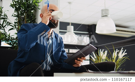 Executive manager searches for solution in development next step, looking at marketing data to find new business strategy. Company expert trying to develop new plan to increase profit. Executive manager searches for solution in development next step, looking at marketing data to find new business strategy. Company expert trying to develop new plan to increase profit. 110167117