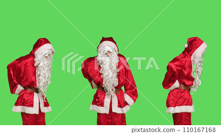 Unwell santa claus having back pain while he is wearing iconic red costume with hat, feeling sick on holidays. Father christmas dealing with spinal ache from giving presents to children. Unwell santa claus having back pain while he is wearing iconic red costume with hat, feeling sick on holidays. Father christmas dealing with spinal ache from giving presents to children. 110167168