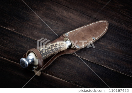 Vintage hunting knife with leather holster 110167423
