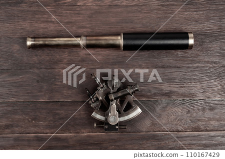 Retro vintage spyglass telescope with sextant Retro vintage spyglass telescope with sextant 110167429