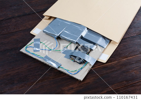 Mail bomb IED - Improvised Explosive Device with c4 and cell phone module in envelope Mail bomb IED - Improvised Explosive Device with c4 and cell phone module in envelope 110167431