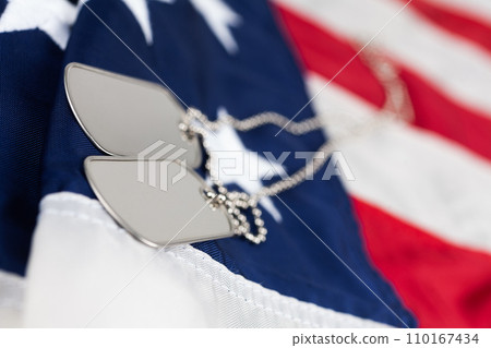 US army dog tags on USA national flag US army dog tags on USA national flag 110167434