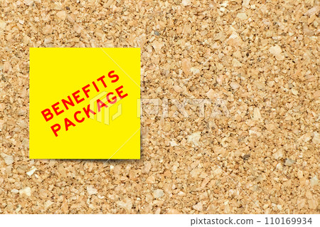 Yellow note paper with word benefits package on cork board background with copy space Yellow note paper with word benefits package on cork board background with copy space 110169934