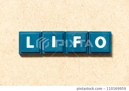 Tile alphabet letter in word LIFO (abbreviation of last in first out) on wood background Tile alphabet letter in word LIFO (abbreviation of last in first out) on wood background 110169959