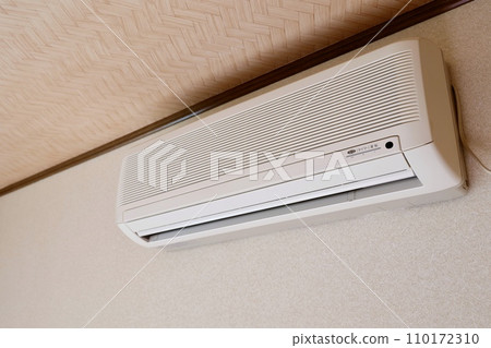 Air conditioner installed on the wall of your home Air conditioner installed on the wall of your home 110172310