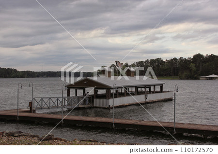 Public Fishing Pier on Lake Tyler in Rural East Texas on Cloudy Day 110172570