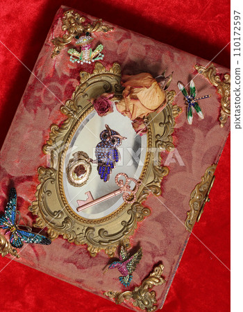 Antique Book With Colorful Gemstones and Mirror. Fairy Tale Romance Book Antique Book With Colorful Gemstones and Mirror. Fairy Tale Romance Book 110172597