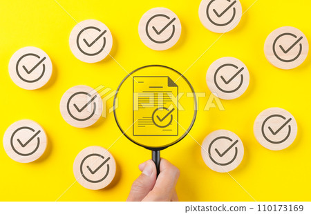 Quality assurance document control concept. Magnifying glass focus on correct sign mark document approved paperless and quality assurance approve, Checkmark round wooden, quality standard certificate, Quality assurance document control concept. Magnifying glass focus on correct sign mark document approved paperless and quality assurance approve, Checkmark round wooden, quality standard certificate, 110173169