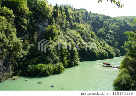 Geological wonders, lush greenery, and underground river rafting adventures. 110173189