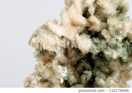 macro stone mineral stilbite on Apophyllite on a white background macro stone mineral stilbite on Apophyllite on a white background 110176606