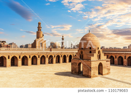 Minaret and ablution fountain of the Ibn Tulun Mosque, colourful view of old Cairo, Egypt Minaret and ablution fountain of the Ibn Tulun Mosque, colourful view of old Cairo, Egypt 110179083