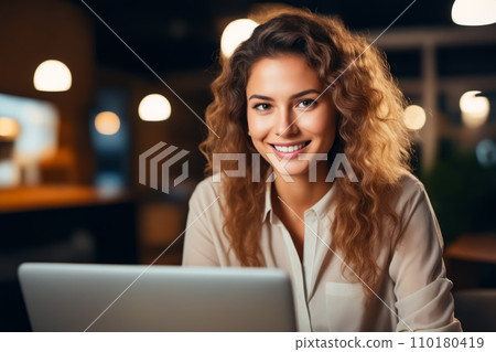 Woman smiling while looking at laptop computer screen. Generative AI 110180419