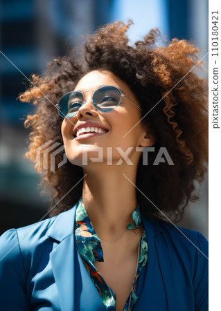 Woman with blue shirt and sunglasses smiling at the camera. Generative AI 110180421