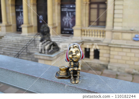 Kaliningrad, Russia, bronze statuette of homlin papa Leo in a warm hat, city brownie, local landmark Kaliningrad, Russia, bronze statuette of homlin papa Leo in a warm hat, city brownie, local landmark 110182244