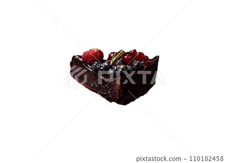 Delicious sweet chocolate brownie cake with blueberries, currants and raspberries 110182458