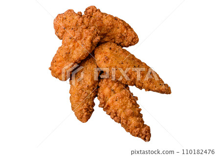 Delicious crispy chicken nuggets breaded with salt and spices 110182476