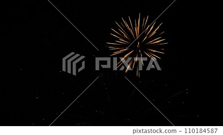 Breathtaking firework bursts color sky with abstract vivid patterns on holiday 110184587