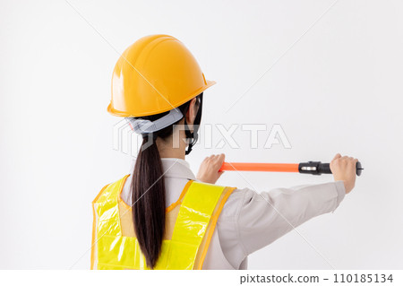 A security guard wearing a reflective vest to guide 110185134