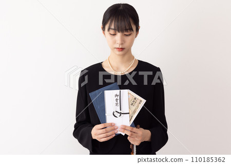 A woman who gives out a ghost funeral image A woman who gives out a ghost funeral image 110185362