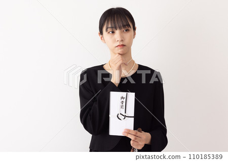 A woman who gives out a ghost funeral image A woman who gives out a ghost funeral image 110185389