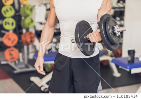 Senior man parts lifting dumbbells Senior man parts lifting dumbbells 110185414