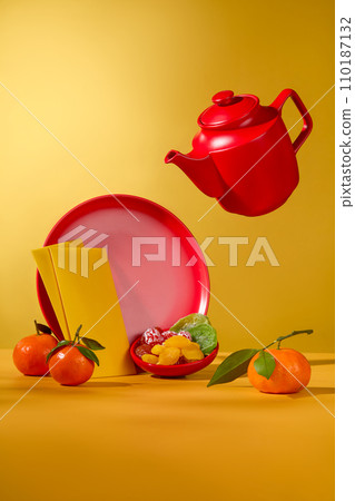 Round dish containing dried candied fruits arranged with tangerines and envelopes. Concept of Happy Chinese New Year festival background Round dish containing dried candied fruits arranged with tangerines and envelopes. Concept of Happy Chinese New Year festival background 110187132