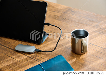 Tablet terminal and business goods placed on the desk Tablet terminal and business goods placed on the desk 110188538