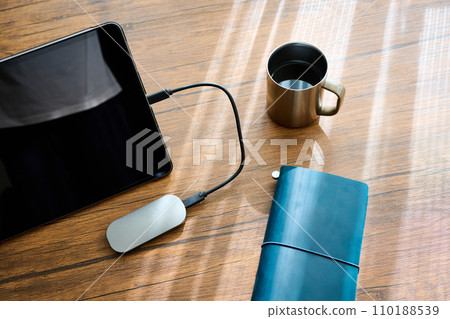 Tablet terminal and business goods placed on the desk Tablet terminal and business goods placed on the desk 110188539