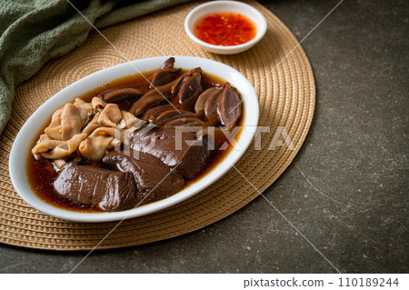 stewed duck offal in brown soup 110189244
