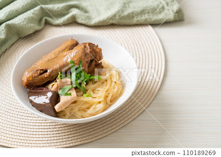 dried noodles with braised duck in white bowl dried noodles with braised duck in white bowl 110189269