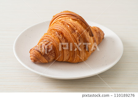 fresh croissant on white plate fresh croissant on white plate 110189276