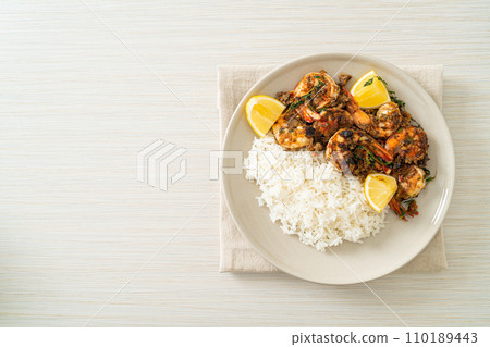 jerk shrimps or grilled shrimps in Jamaica style with rice 110189443