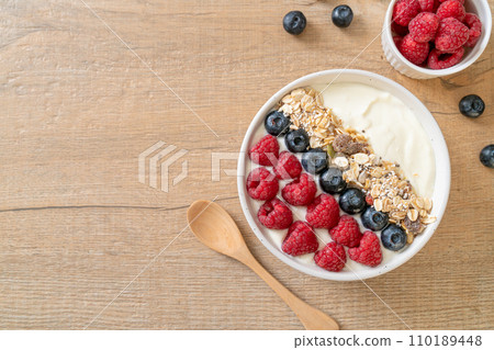 homemade yogurt bowl with raspberry, blueberry and granola homemade yogurt bowl with raspberry, blueberry and granola 110189448