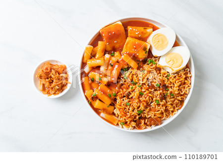 Korean instant noodles with Korean rice cake and fish cake and boiled egg Korean instant noodles with Korean rice cake and fish cake and boiled egg 110189701