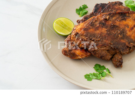 spicy grilled jamaican jerk chicken 110189707