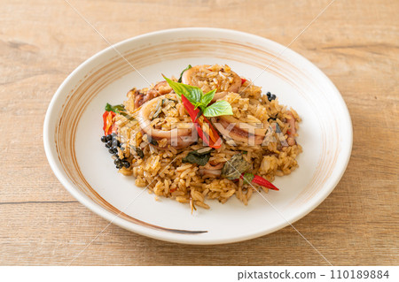 Basil and Spicy Herb Fried Rice with Squid or Octopus Basil and Spicy Herb Fried Rice with Squid or Octopus 110189884