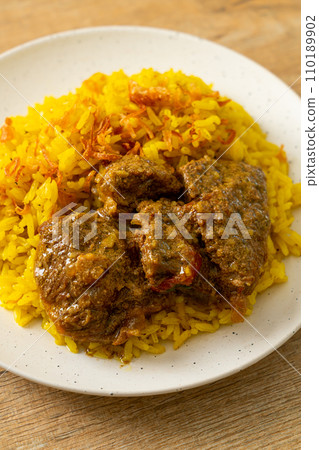 Beef Biryani or Curried rice and beef - Thai-Muslim version of Indian biryani, with fragrant yellow rice and beef Beef Biryani or Curried rice and beef - Thai-Muslim version of Indian biryani, with fragrant yellow rice and beef 110189902