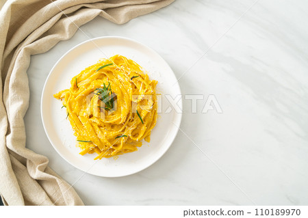 fettuccine pasta with butternut pumpkin creamy sauce 110189970