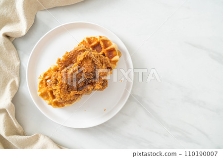 fried chicken waffle with honey or maple syrup 110190007