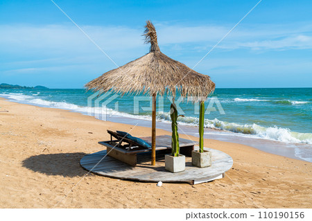 beach chair and umbrella with sea beach background 110190156
