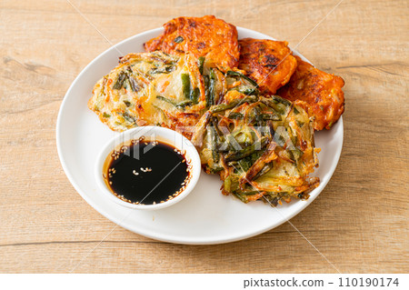 Pajeon or Korean pancake and Korean Kimchi pancake or Kimchijeon on white background 110190174