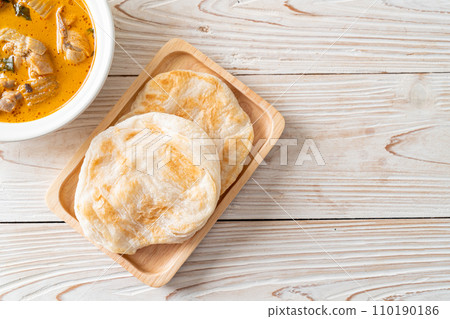 Chicken curry soup with roti Chicken curry soup with roti 110190186