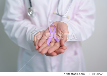 Doctor with purple ribbon for world cancer day, lupus, Pancreatic, Esophageal, Testicular cancer, world Alzheimer, epilepsy, Sarcoidosis, Fibromyalgia and domestic violence Awareness month concepts Doctor with purple ribbon for world cancer day, lupus, Pancreatic, Esophageal, Testicular cancer, world Alzheimer, epilepsy, Sarcoidosis, Fibromyalgia and domestic violence Awareness month concepts 110190529