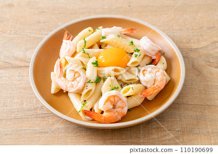 penne pasta white cream sauce with shrimps and egg penne pasta white cream sauce with shrimps and egg 110190699