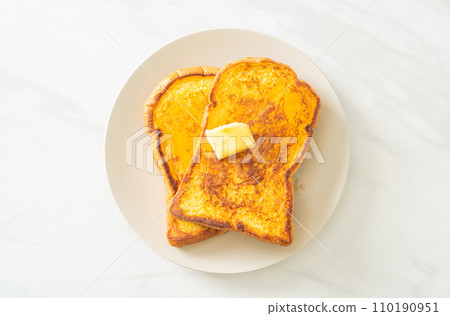 French toasted with butter and honey 110190951