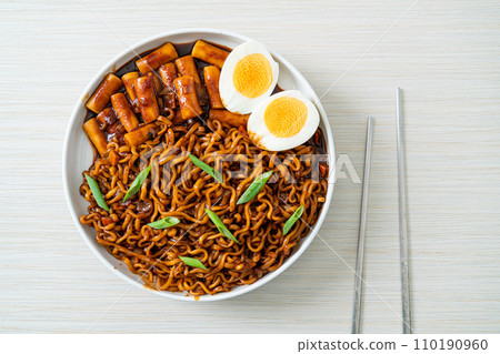 Jjajang Rabokki - Korean instant noodles or Ramyeon with Korean rice cake or Tteokbokki and egg in black bean sauce Jjajang Rabokki - Korean instant noodles or Ramyeon with Korean rice cake or Tteokbokki and egg in black bean sauce 110190960