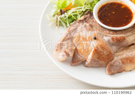grilled pork chop steak with Thai spicy dipping sauce 110190962