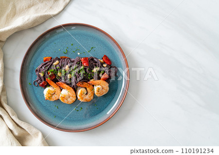 stir-fried black spaghetti with garlic and shrimps stir-fried black spaghetti with garlic and shrimps 110191234
