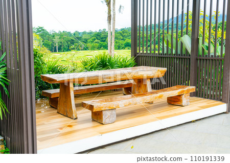 outdoor patio deck and chair with mountain hill background 110191339