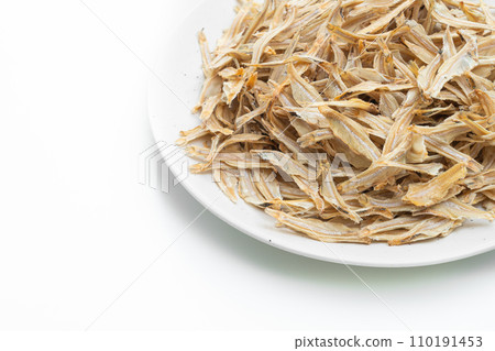 dried small crispy fish on white background dried small crispy fish on white background 110191453